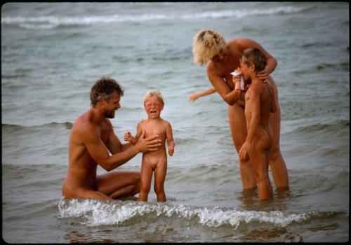 A nude family in the chilly waters of the Baltic Sea.